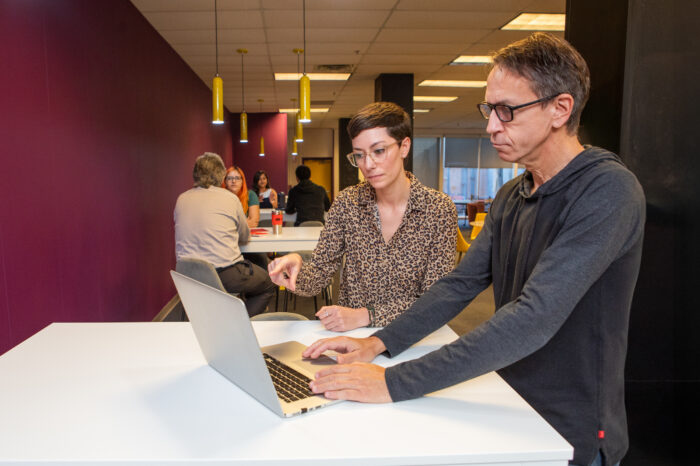 Corporate Lifestyle Photography 2 people looking at a laptop