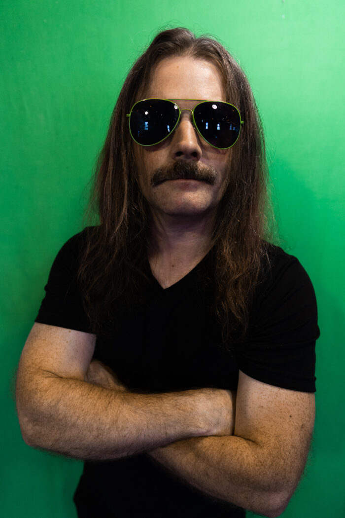 Sean Bolton with Shades on green screen
