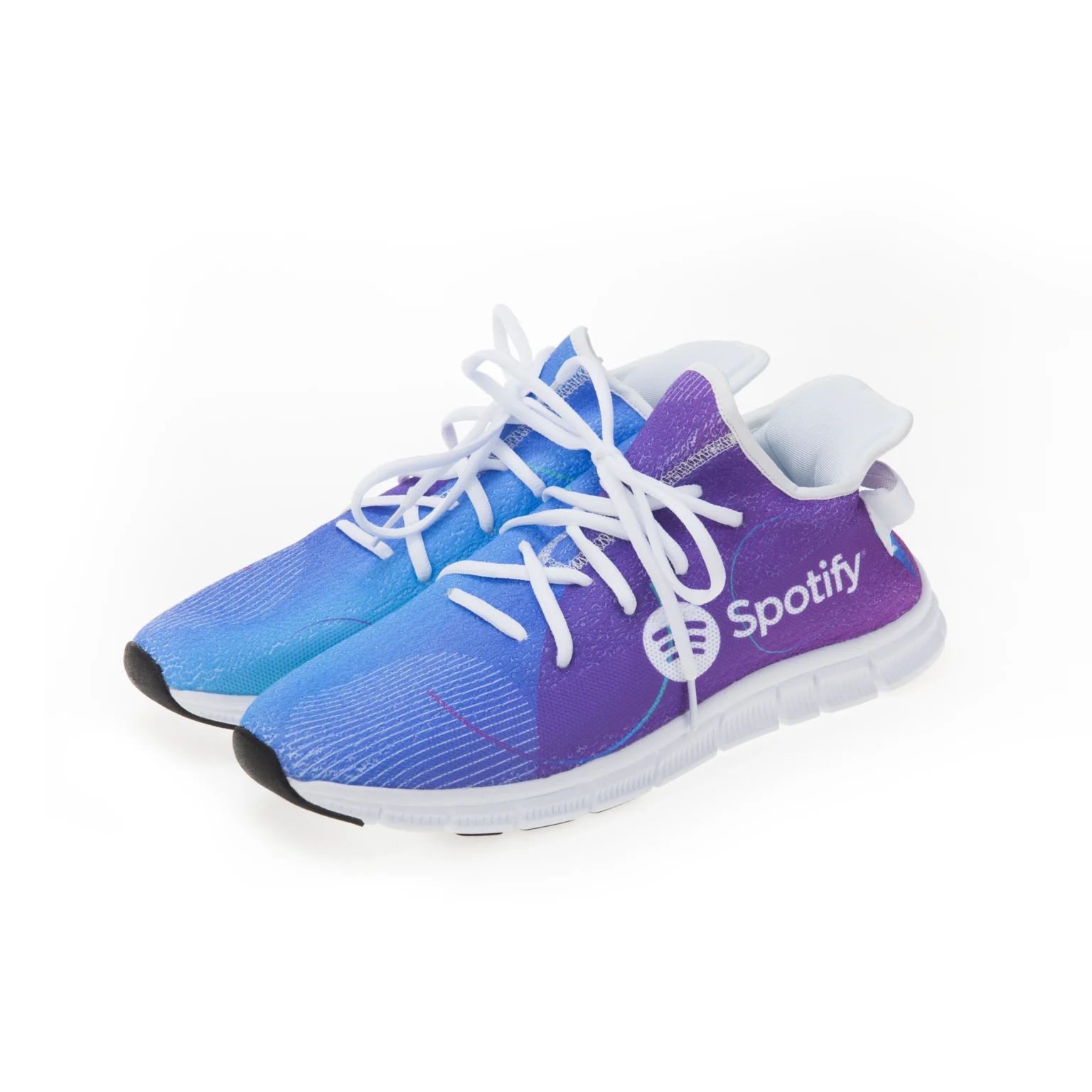 Pair of Spotify-branded running sneakers featuring a purple and blue gradient design on a white background